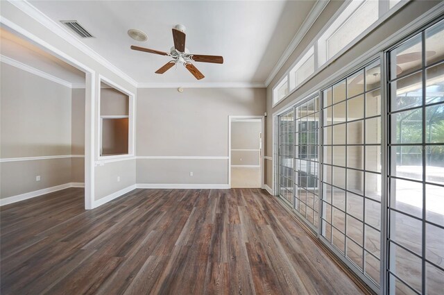 spare room featuring ceiling fan, crown molding, hardwood / wood-style floors, and a healthy amount of sunlight