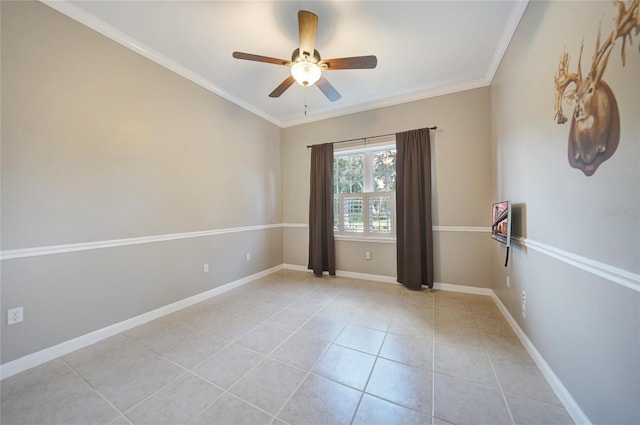 empty room with baseboards, light tile patterned flooring, a ceiling fan, and crown molding