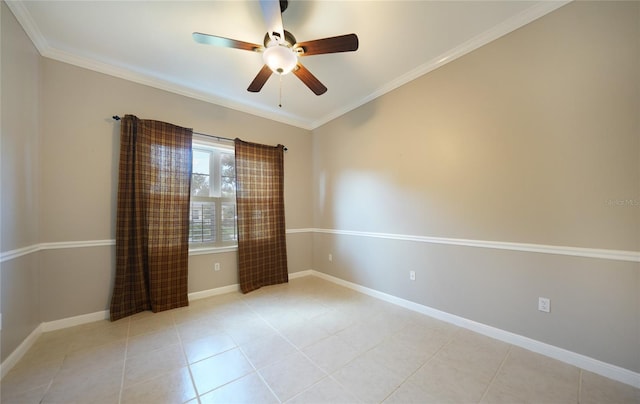 spare room with light tile patterned floors, ornamental molding, a ceiling fan, and baseboards