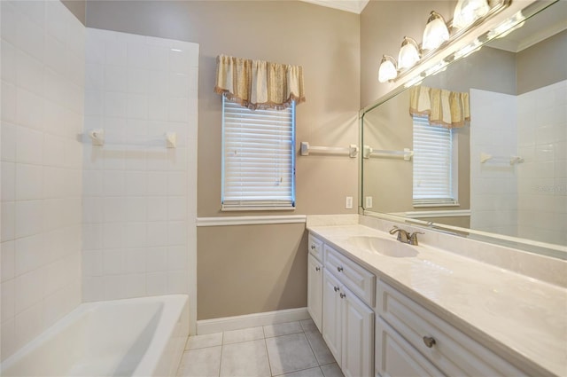 bathroom featuring baseboards, ornamental molding, vanity, and tile patterned floors