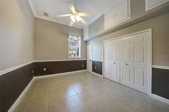 unfurnished bedroom with light tile patterned floors, ornamental molding, visible vents, and baseboards