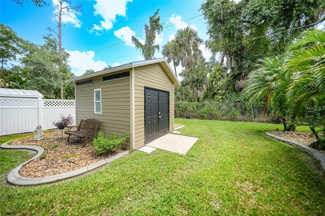 view of shed featuring a fenced backyard