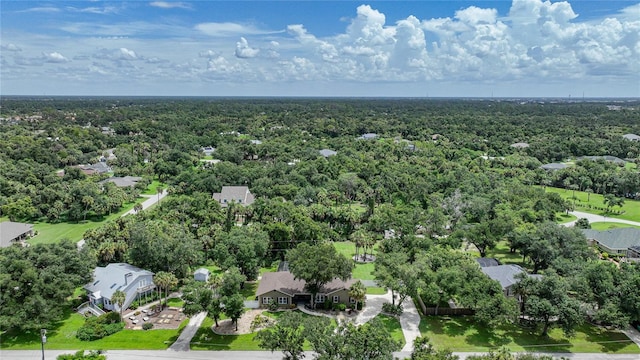 aerial view featuring a residential view and a wooded view