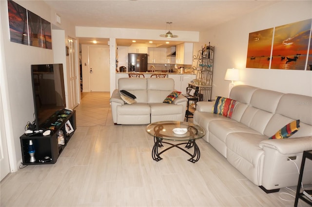 living room featuring sink