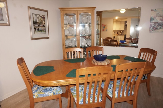 dining room with light wood-type flooring