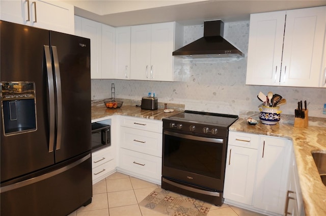 kitchen featuring black appliances, backsplash, wall chimney exhaust hood, and white cabinetry