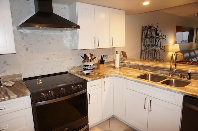 kitchen featuring stainless steel electric range oven, sink, wall chimney exhaust hood, kitchen peninsula, and decorative backsplash