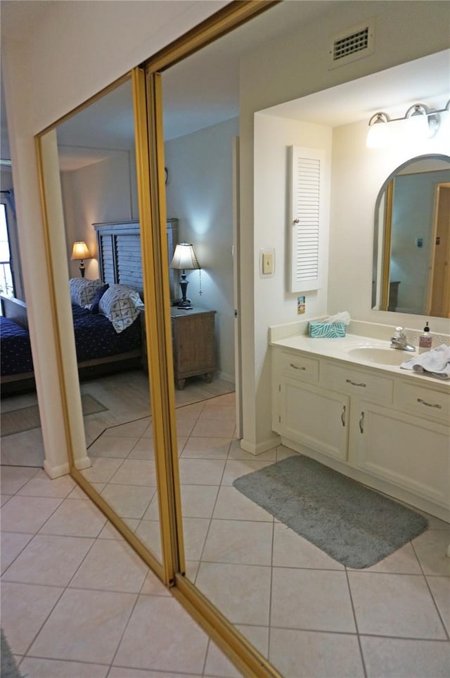 bathroom with vanity and tile patterned floors