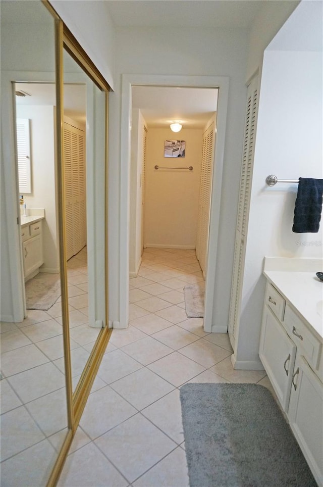 bathroom with vanity and tile patterned flooring