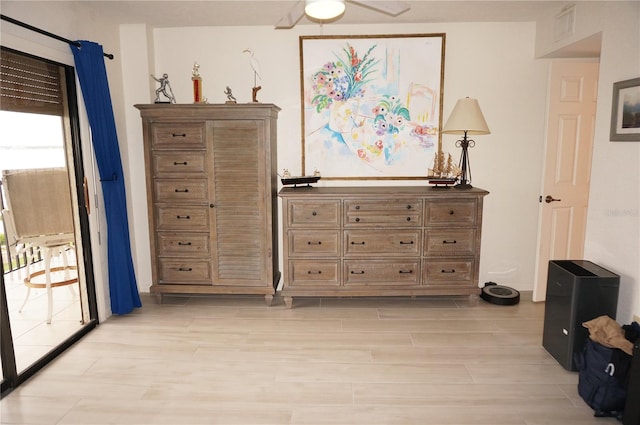 bedroom with light hardwood / wood-style flooring and ceiling fan