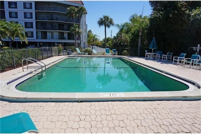 view of swimming pool with a patio area