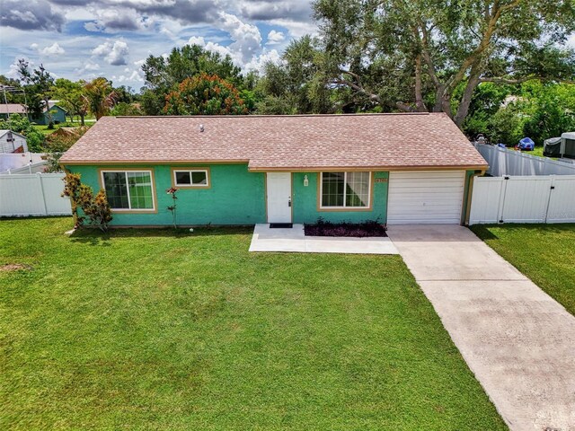 ranch-style home with a front lawn