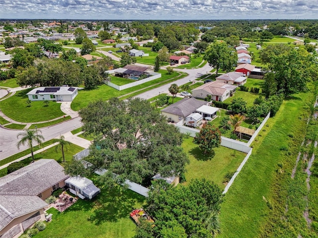 birds eye view of property with a residential view