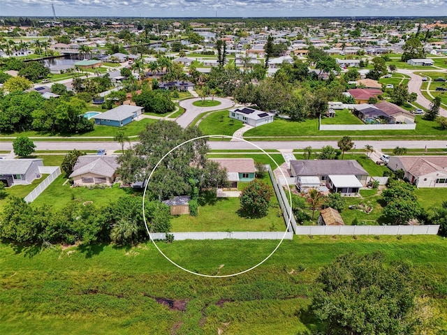 aerial view featuring a water view and a residential view