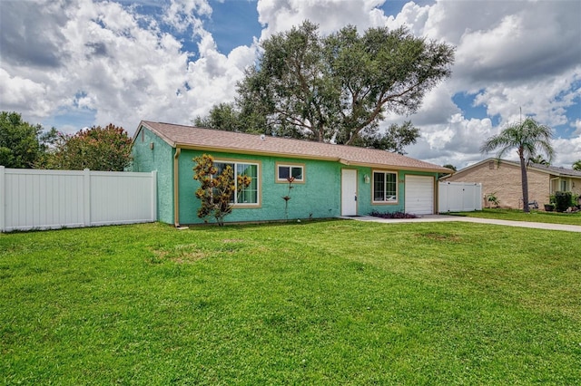 ranch-style house featuring an attached garage, fence, concrete driveway, stucco siding, and a front lawn