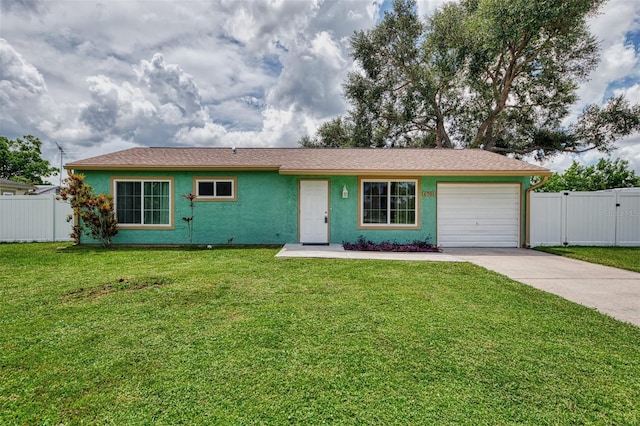 single story home featuring driveway, a garage, fence, a front lawn, and stucco siding