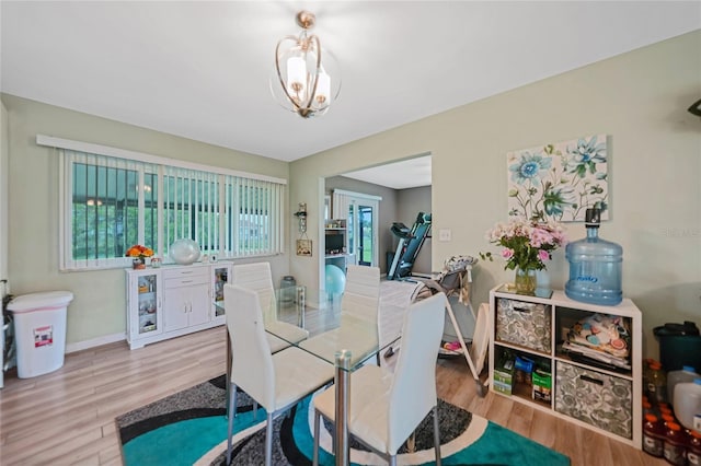 dining room featuring baseboards and wood finished floors