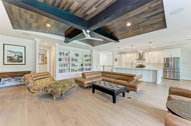 living room with beam ceiling, crown molding, recessed lighting, light wood-style floors, and wooden ceiling