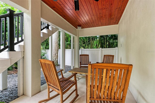 sunroom / solarium featuring wood ceiling