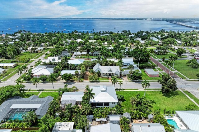 bird's eye view with a residential view and a water view