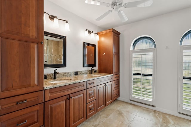 bathroom with ceiling fan and vanity