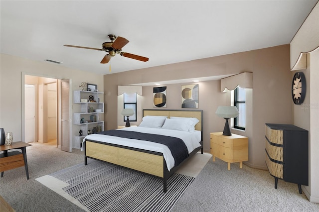 carpeted bedroom with ceiling fan