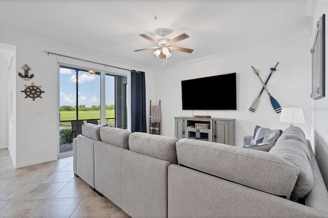 living room featuring ceiling fan, ornamental molding, and light tile patterned floors