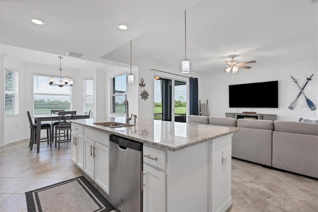 kitchen featuring hanging light fixtures, ceiling fan with notable chandelier, white cabinetry, a kitchen island with sink, and stainless steel dishwasher