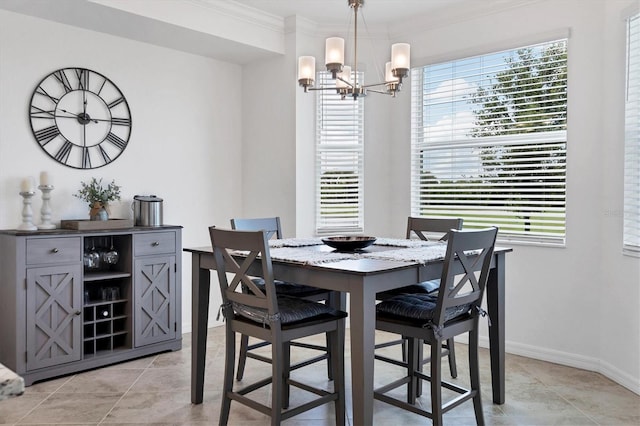 dining room with crown molding, plenty of natural light, light tile patterned floors, and a chandelier