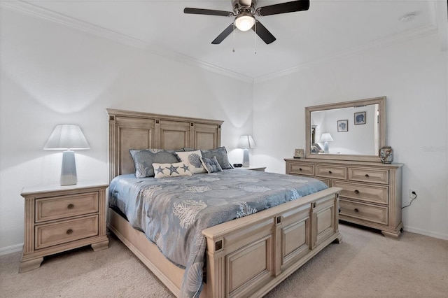 carpeted bedroom with ceiling fan and ornamental molding