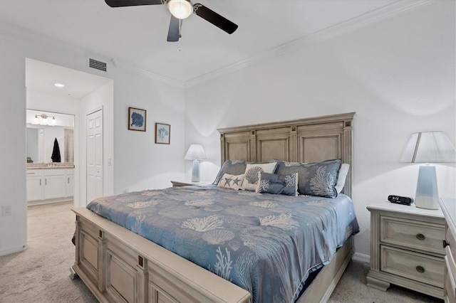 carpeted bedroom featuring ceiling fan, connected bathroom, and ornamental molding