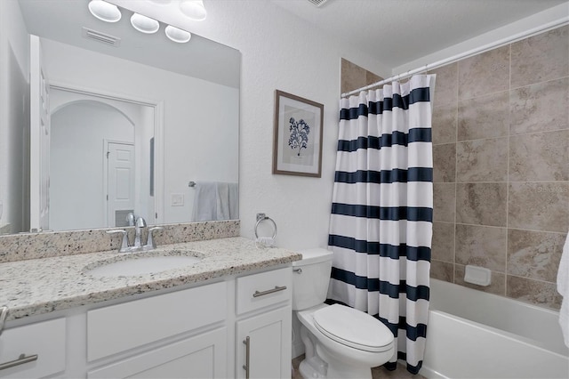 full bathroom featuring vanity, toilet, and shower / bath combo