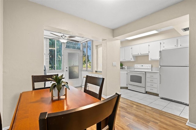 dining area featuring ceiling fan and light hardwood / wood-style flooring