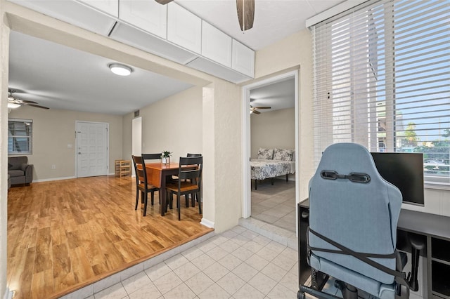 office space featuring ceiling fan and light tile patterned floors