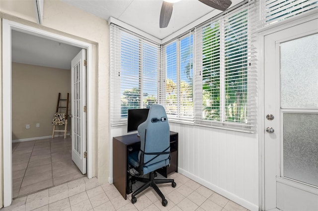 office featuring light tile patterned floors and ceiling fan