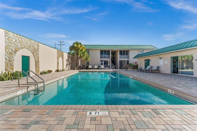 view of pool featuring a patio