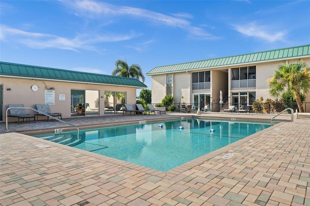 view of swimming pool featuring a patio