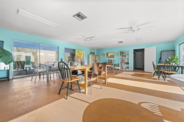 dining space featuring ceiling fan and a healthy amount of sunlight