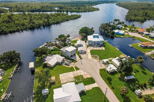 birds eye view of property featuring a water view and a residential view