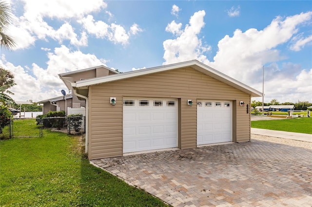 garage with a yard