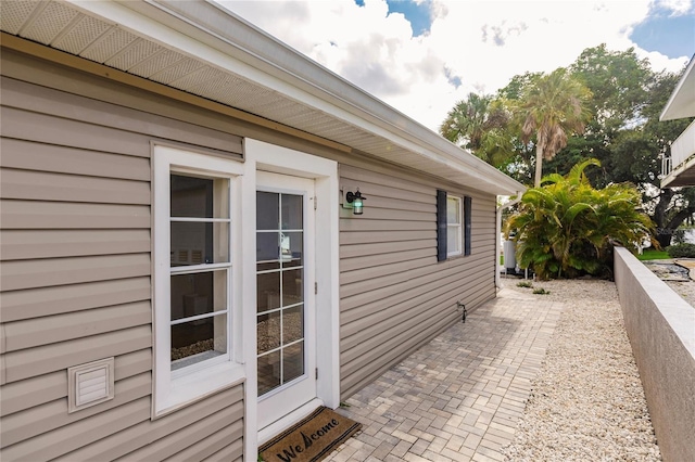 view of home's exterior featuring a patio area and fence