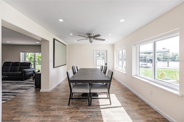 dining room with dark wood-type flooring and ceiling fan