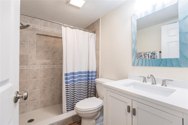 bathroom featuring a shower with curtain, toilet, and vanity