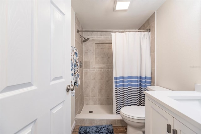 bathroom with vanity, toilet, and a shower with curtain