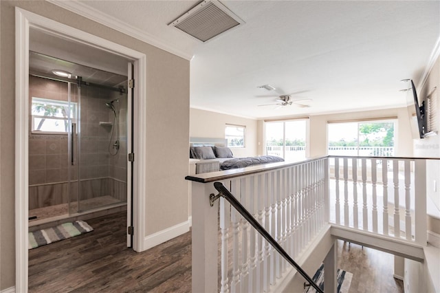 hallway with crown molding and dark hardwood / wood-style flooring