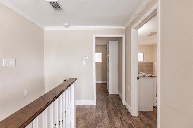 hall featuring crown molding and dark wood-type flooring