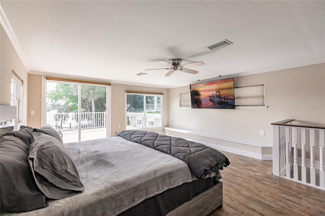 bedroom with ornamental molding, a textured ceiling, wood-type flooring, access to exterior, and ceiling fan