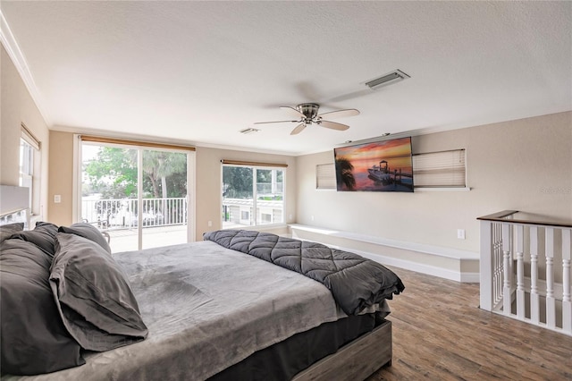 bedroom featuring access to exterior, visible vents, crown molding, and wood finished floors