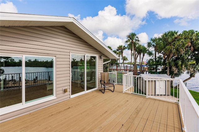 wooden deck featuring a water view