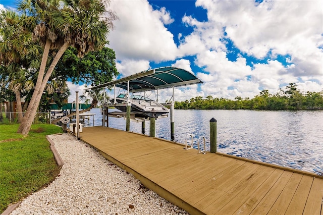 view of dock featuring a water view and boat lift